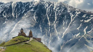 Gergeti Trinity Church with Kazbegi mountains